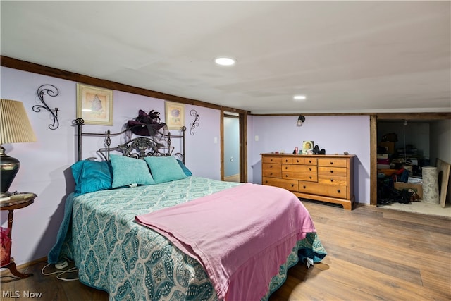 bedroom with hardwood / wood-style flooring