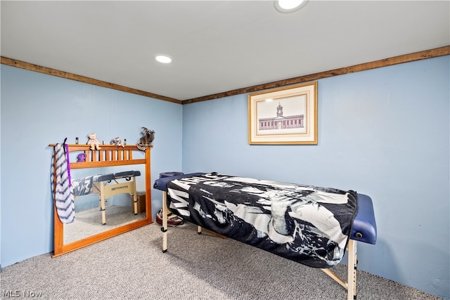 carpeted bedroom with ornamental molding