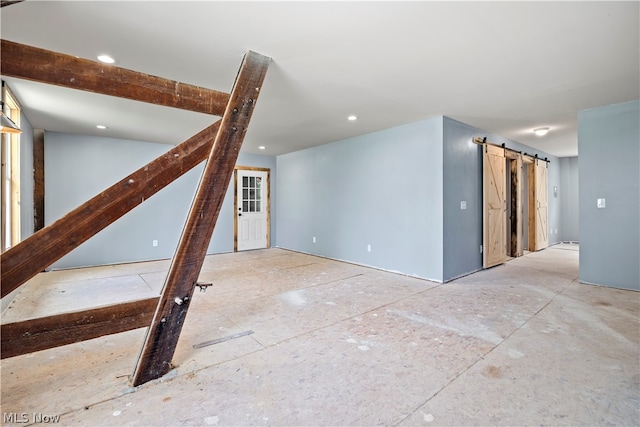 interior space featuring a barn door