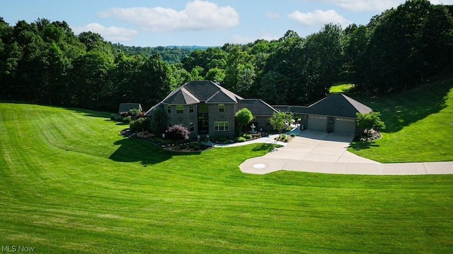 view of front facade featuring a garage and a front lawn