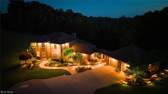 exterior space with a garage and a yard