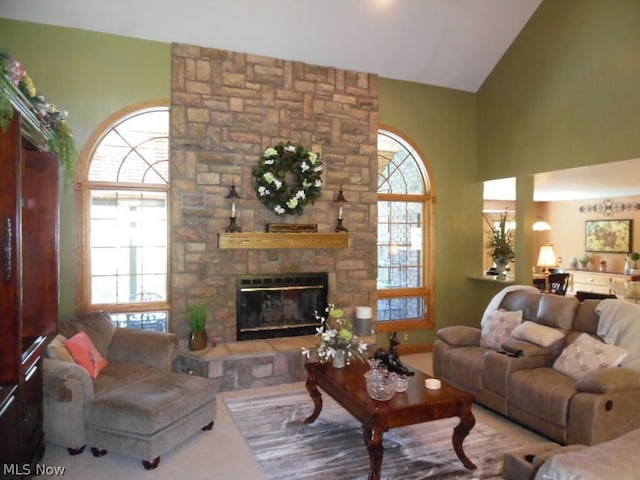 living room featuring a fireplace and vaulted ceiling