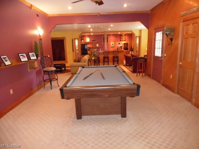 playroom with ceiling fan, billiards, bar area, crown molding, and light colored carpet