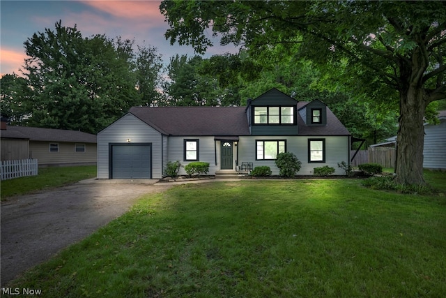 view of front facade featuring a yard and a garage