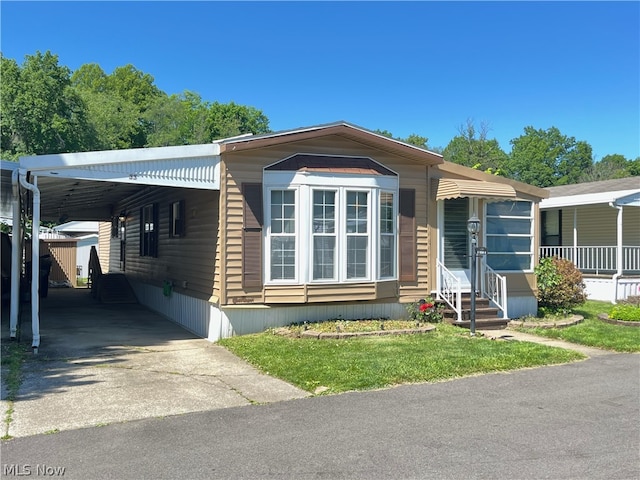 manufactured / mobile home with a carport