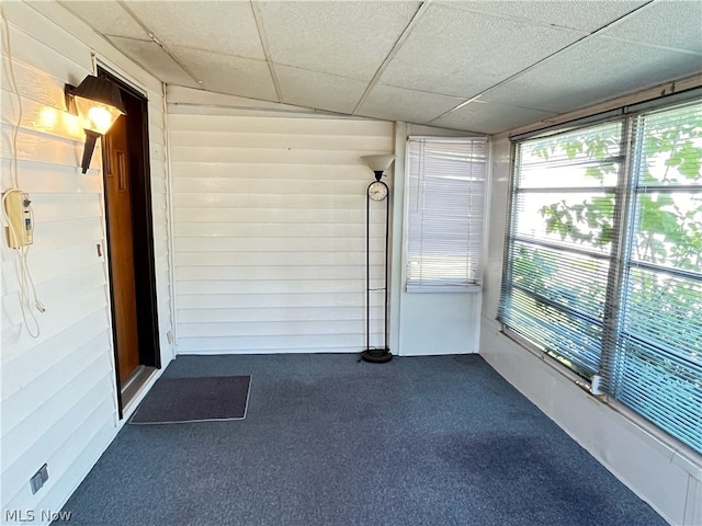 unfurnished sunroom featuring a paneled ceiling