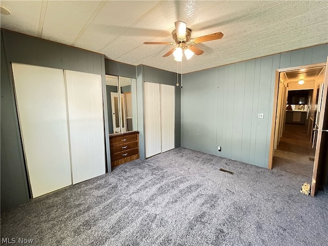 unfurnished bedroom featuring carpet flooring and ceiling fan