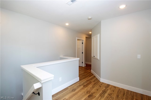 hallway featuring light hardwood / wood-style flooring