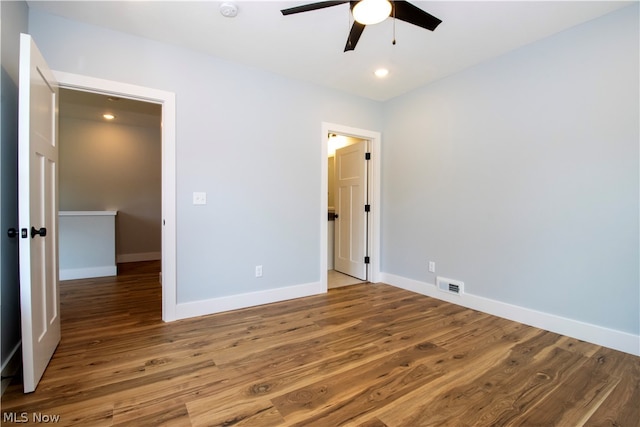 unfurnished bedroom with ceiling fan and hardwood / wood-style floors