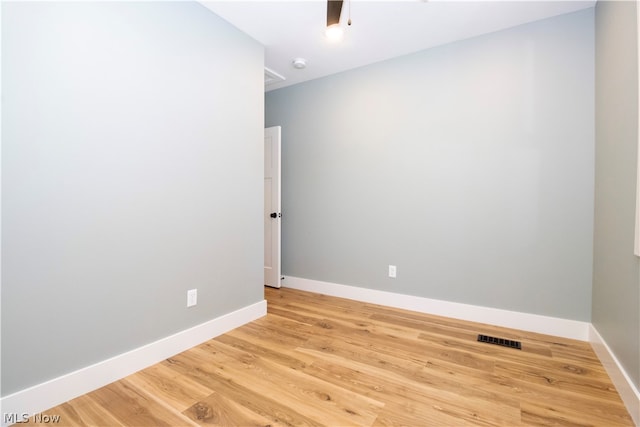 spare room with light hardwood / wood-style flooring