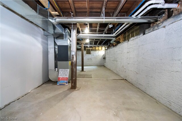 basement featuring heating utilities