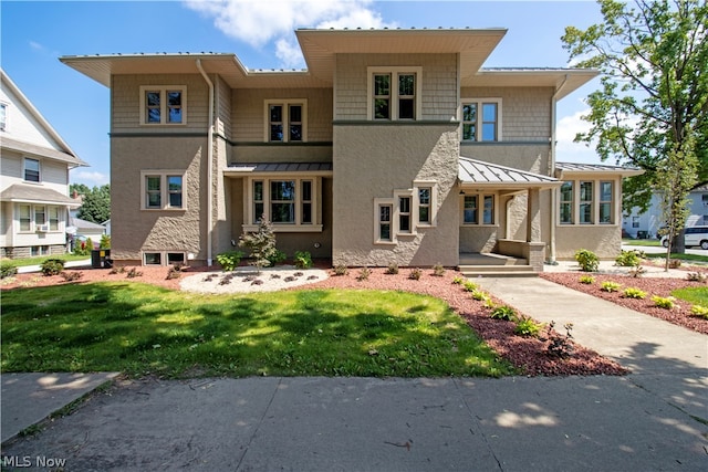 view of front facade with a front yard