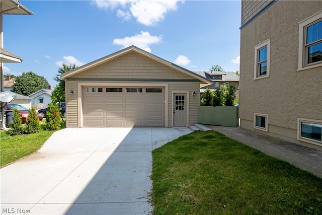 garage featuring a yard