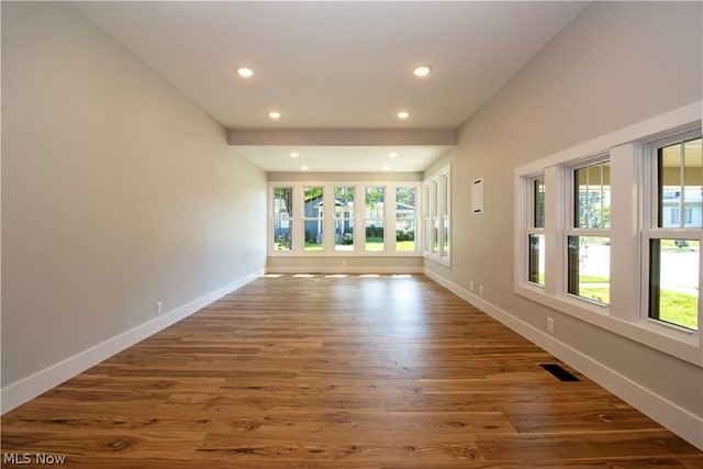 unfurnished room featuring dark wood-type flooring