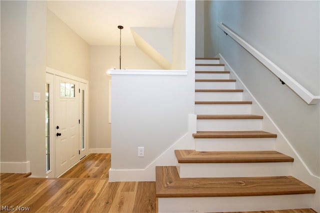 stairs with light wood-type flooring