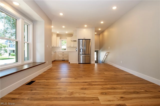 unfurnished living room featuring hardwood / wood-style floors