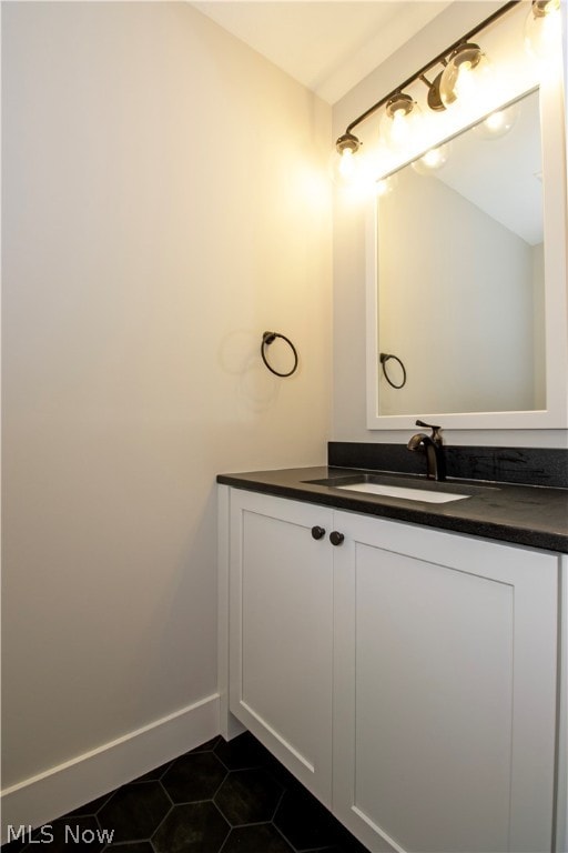 bathroom featuring tile floors and vanity