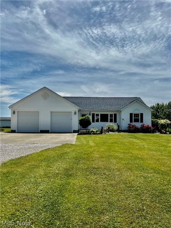 ranch-style house with a front yard and a garage