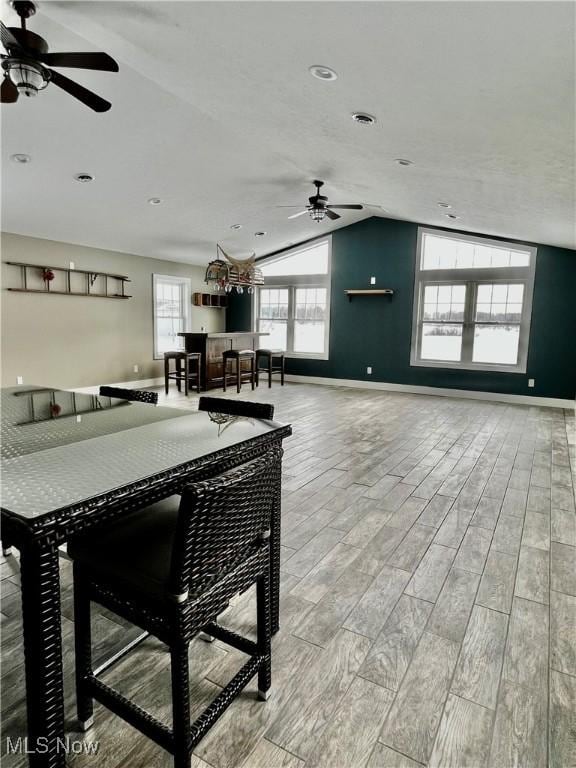 dining room with lofted ceiling and ceiling fan