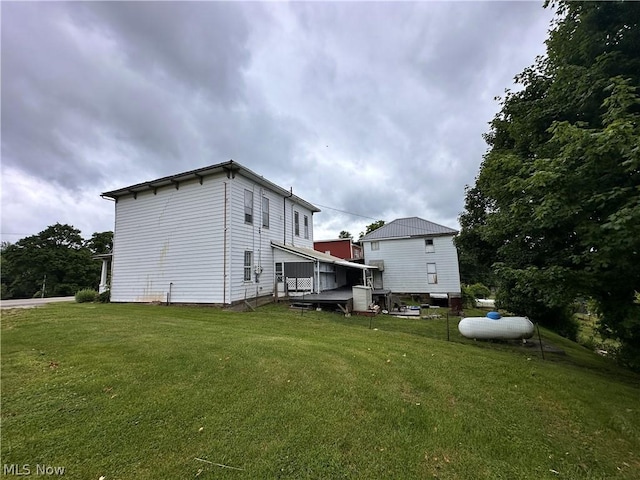 view of home's exterior with a yard