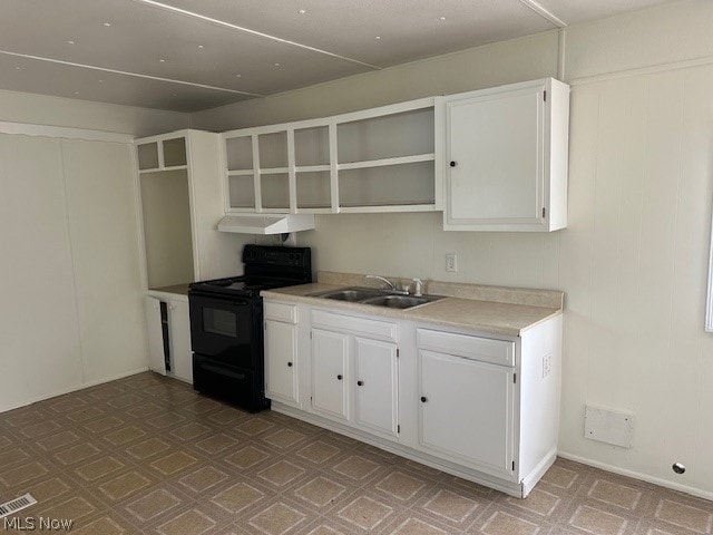 kitchen with under cabinet range hood, a sink, white cabinetry, black electric range oven, and open shelves