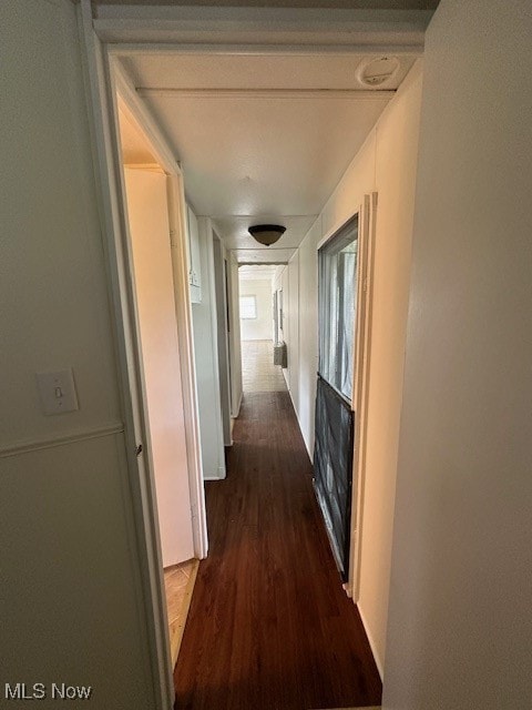 corridor with dark wood finished floors