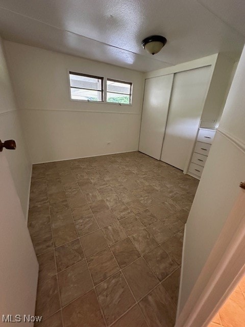 unfurnished bedroom featuring a closet