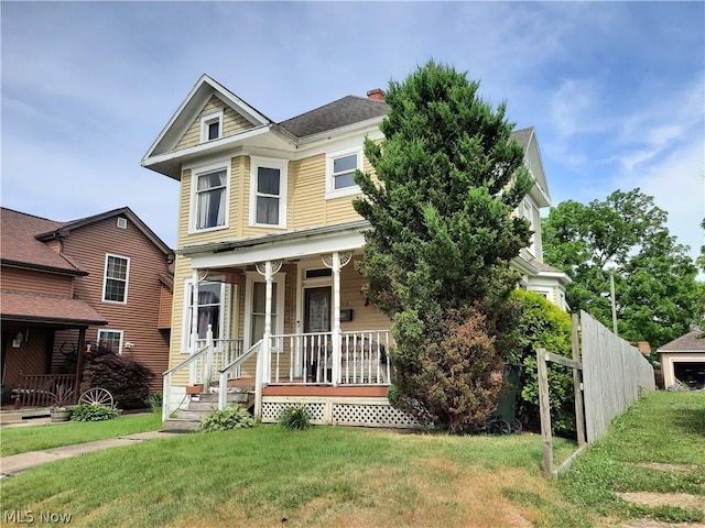 view of front of home featuring a porch and a front lawn