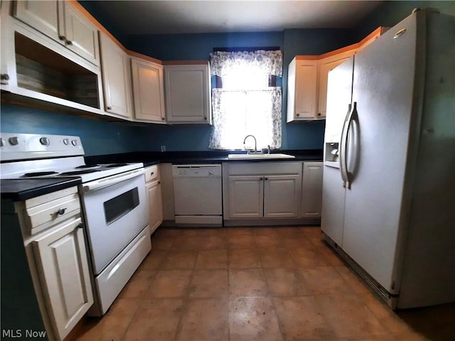 kitchen with sink and white appliances