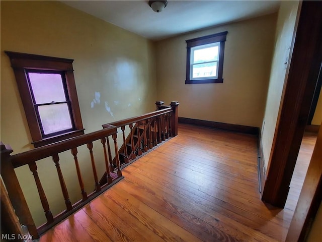 stairway featuring hardwood / wood-style floors