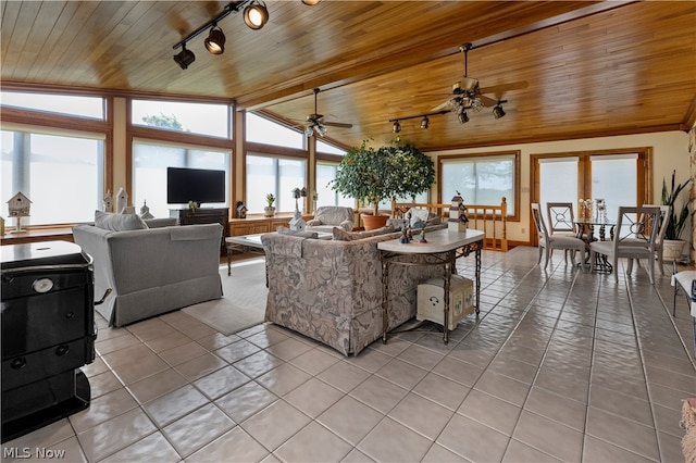 tiled living room featuring vaulted ceiling with beams, ceiling fan, wooden ceiling, and track lighting