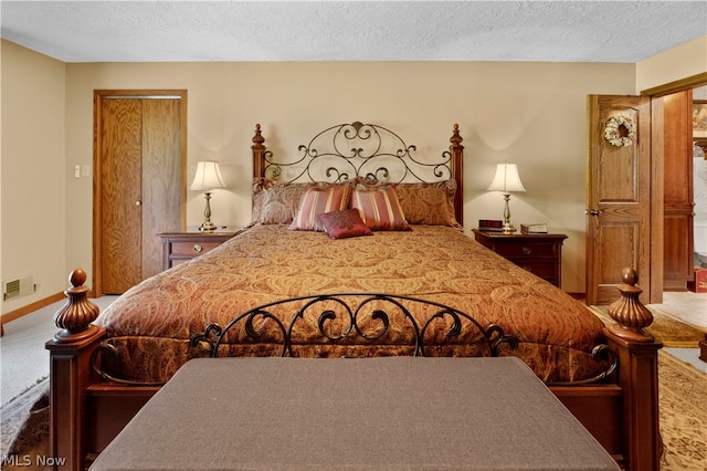 bedroom featuring a textured ceiling