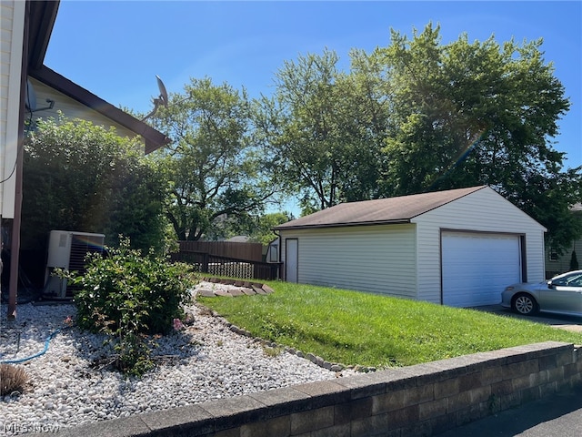 exterior space with a garage, an outdoor structure, and central AC unit