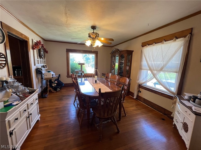 dining space with crown molding, dark hardwood / wood-style floors, and ceiling fan