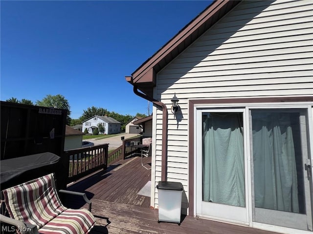 view of property exterior with a wooden deck