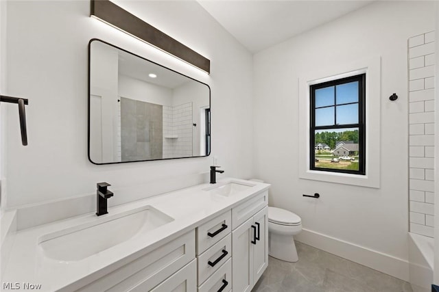 bathroom featuring tile patterned floors, toilet, a shower, and vanity