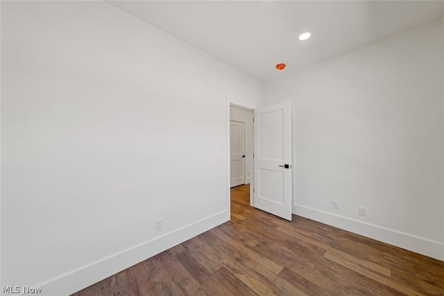 empty room featuring hardwood / wood-style flooring