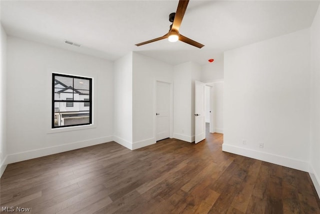 unfurnished bedroom with dark hardwood / wood-style floors and ceiling fan