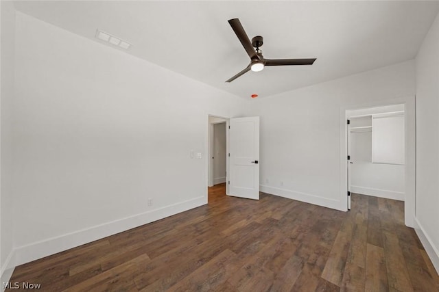 unfurnished bedroom with a closet, dark hardwood / wood-style floors, and ceiling fan