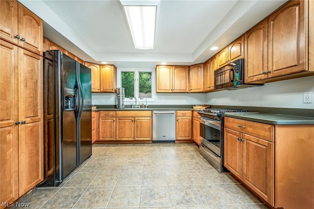 kitchen with sink, light tile patterned flooring, and black appliances