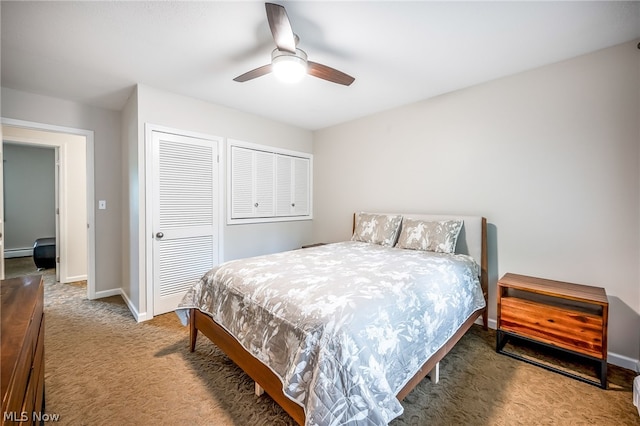 carpeted bedroom with baseboard heating and ceiling fan