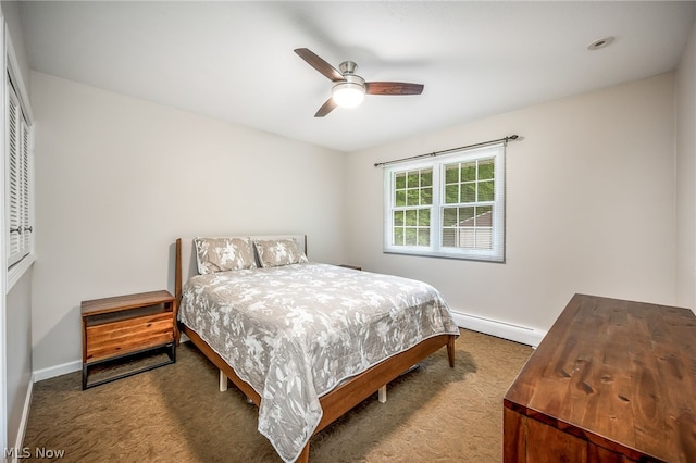 carpeted bedroom featuring ceiling fan and a baseboard radiator