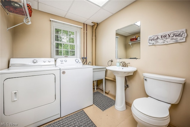 washroom featuring separate washer and dryer and sink