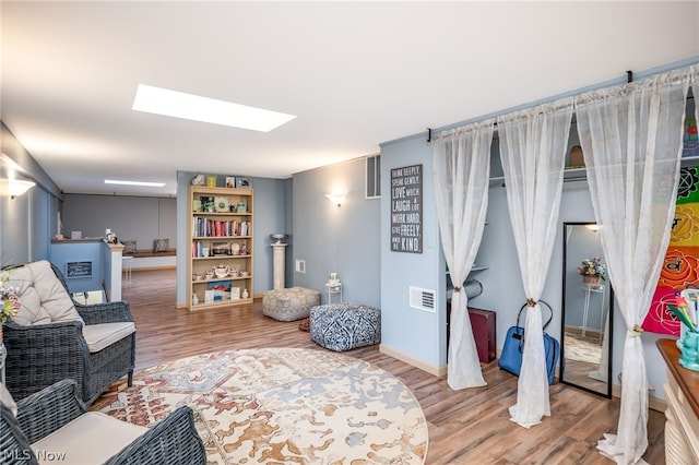 sitting room featuring hardwood / wood-style flooring