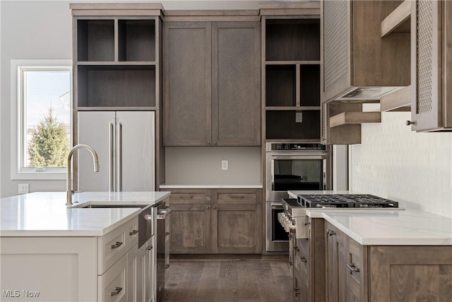 kitchen with dark hardwood / wood-style flooring and high quality appliances