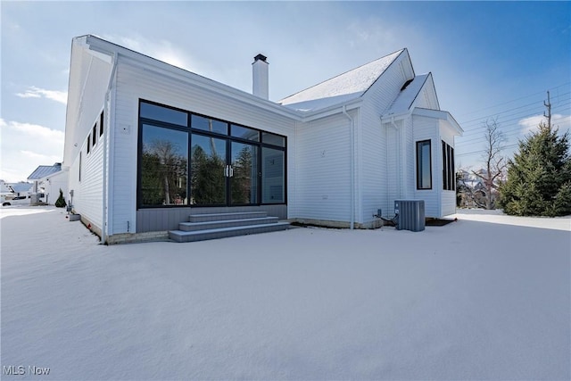 rear view of property with cooling unit