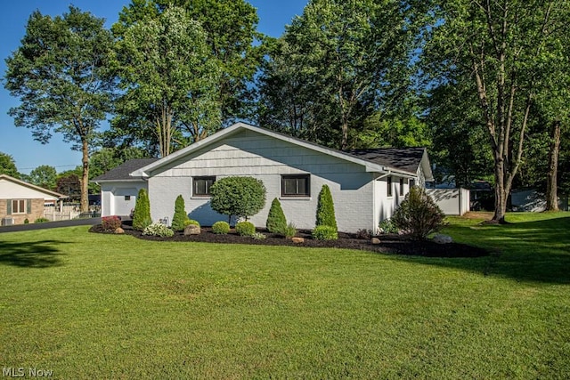 view of home's exterior with a lawn