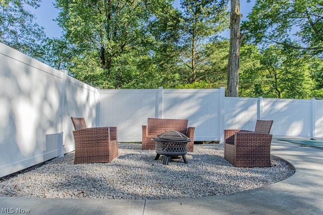 view of patio with a fire pit