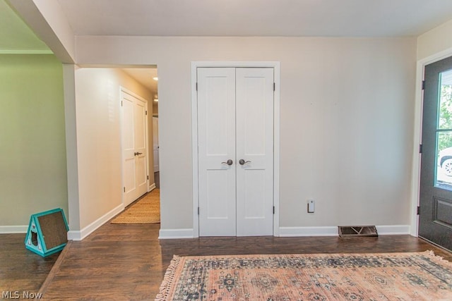 entryway with dark hardwood / wood-style floors