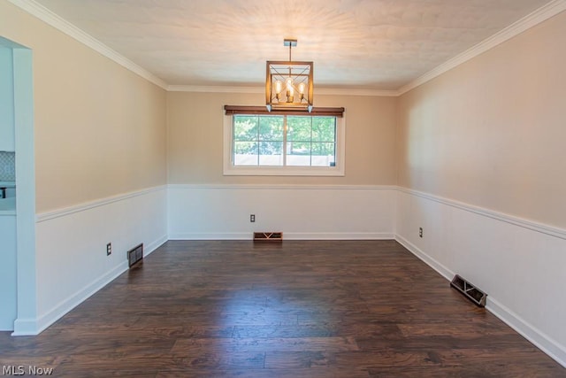 empty room with crown molding, dark hardwood / wood-style floors, and an inviting chandelier